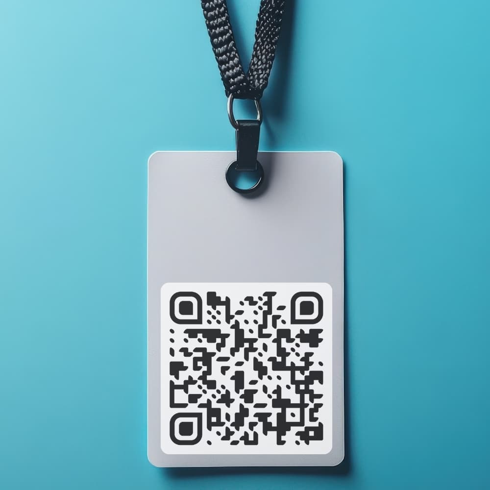 Name badge on a lanyard with a TipMe QR code printed on it
