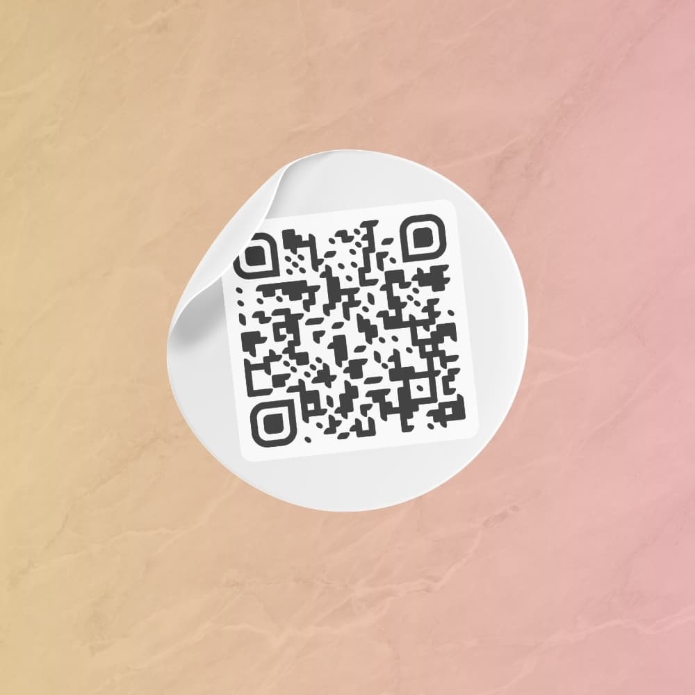 Round sticker with a TipMe QR code applied to a countertop